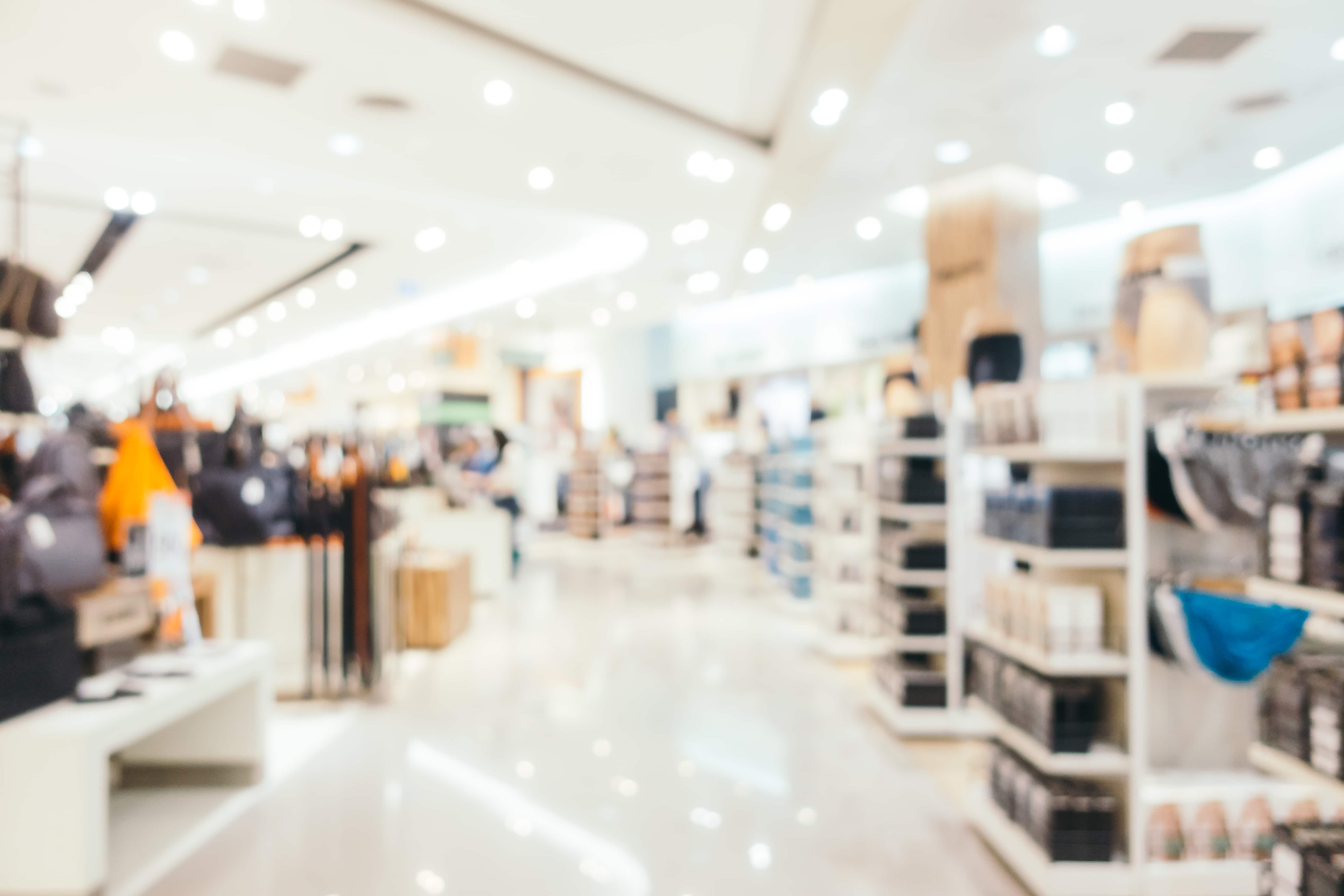 A blurry picture of people shopping in a store.