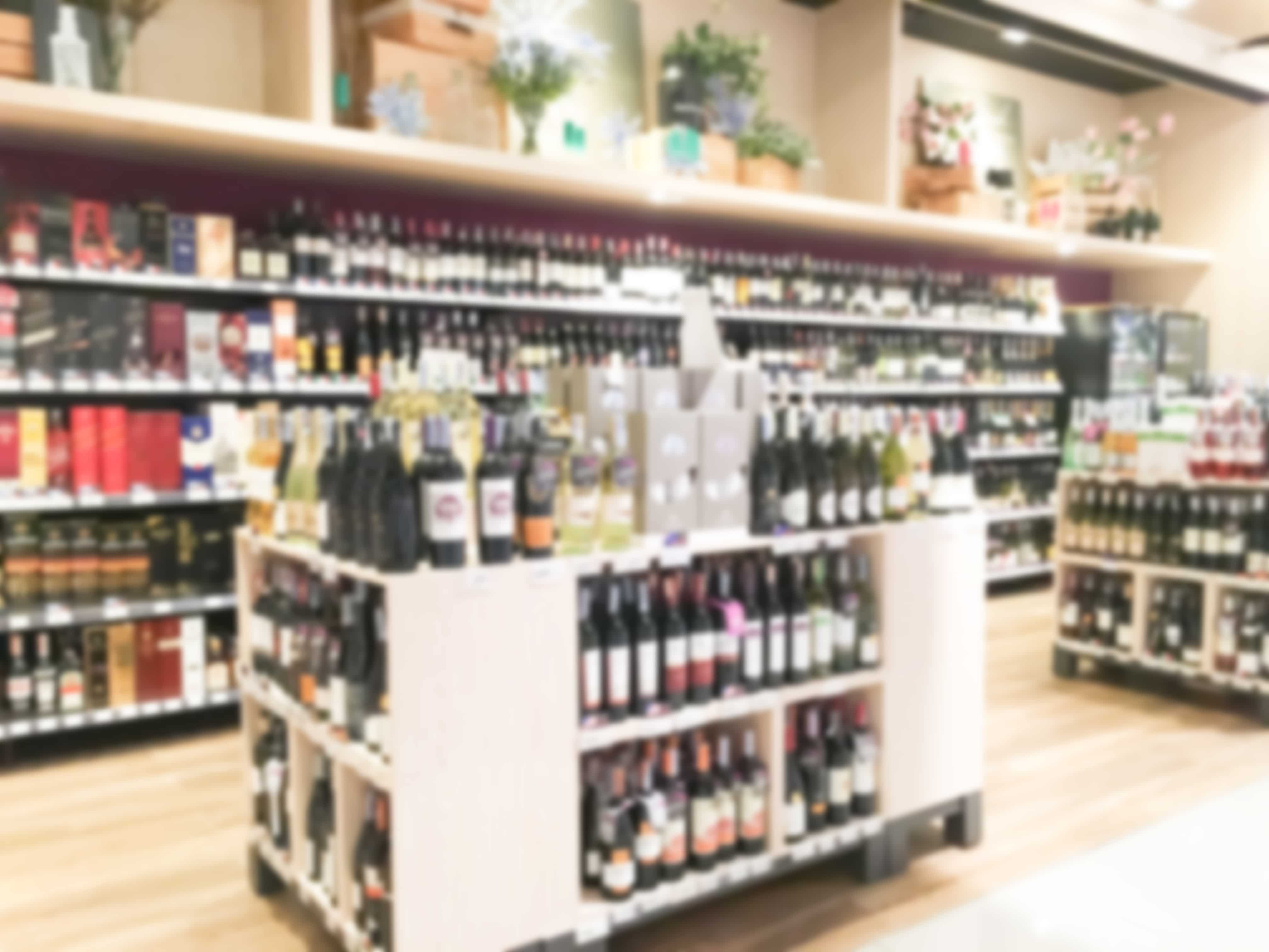 A store with many bottles of wine on display.