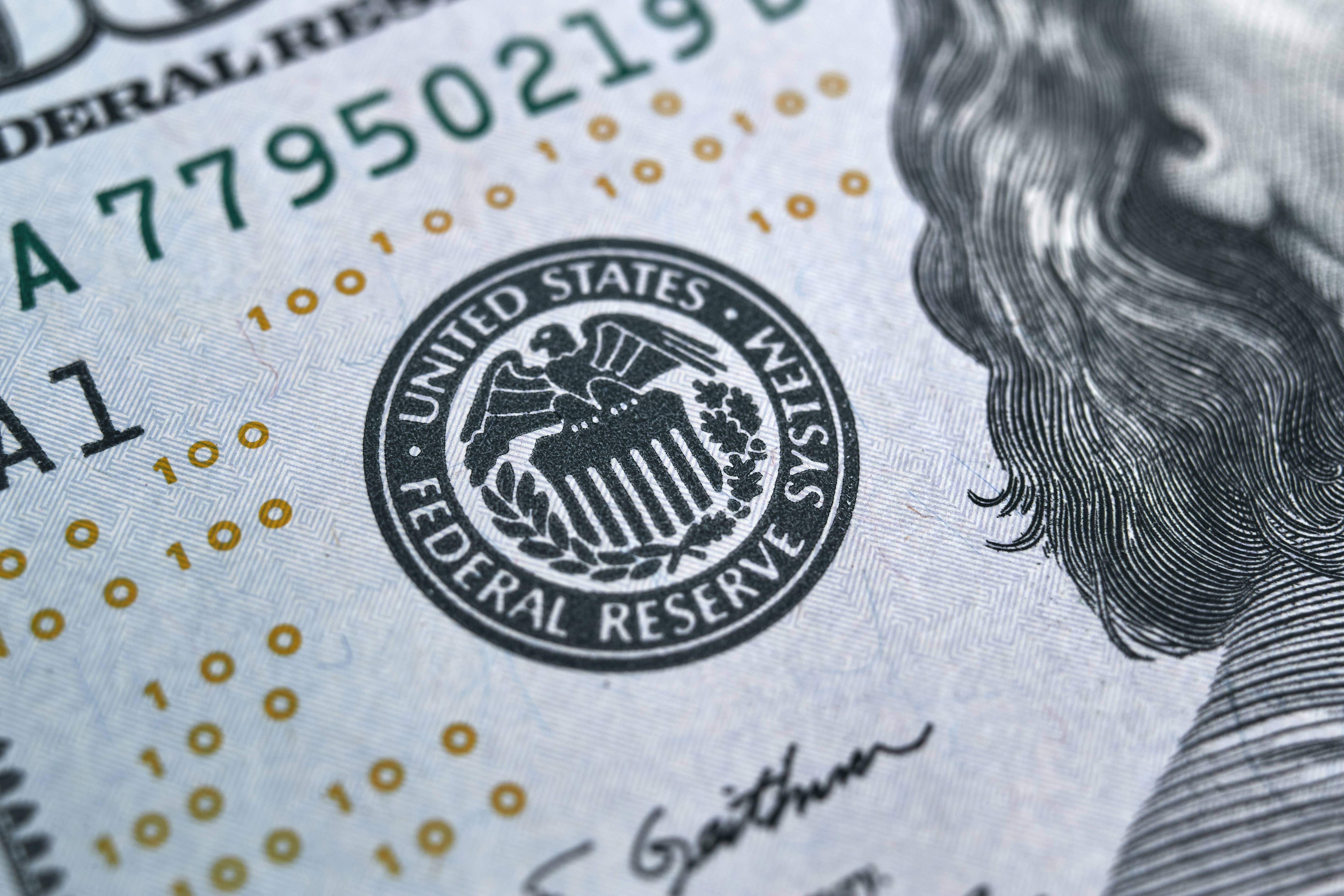 A close up of the federal reserve seal on a $ 1 0 bill.
