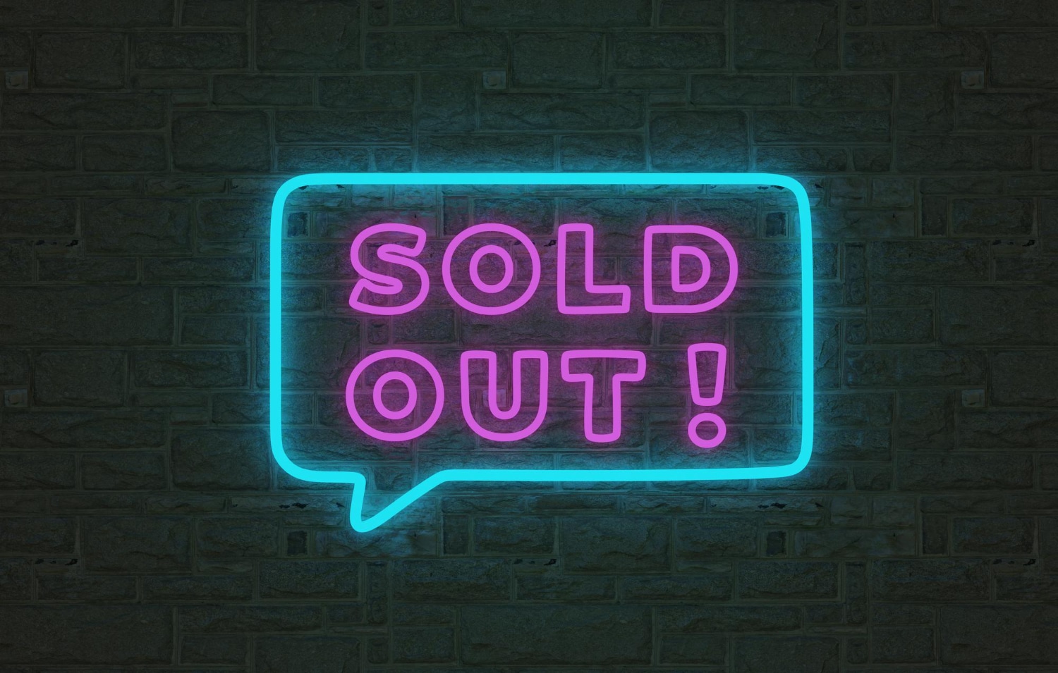 A neon sign that says sold out