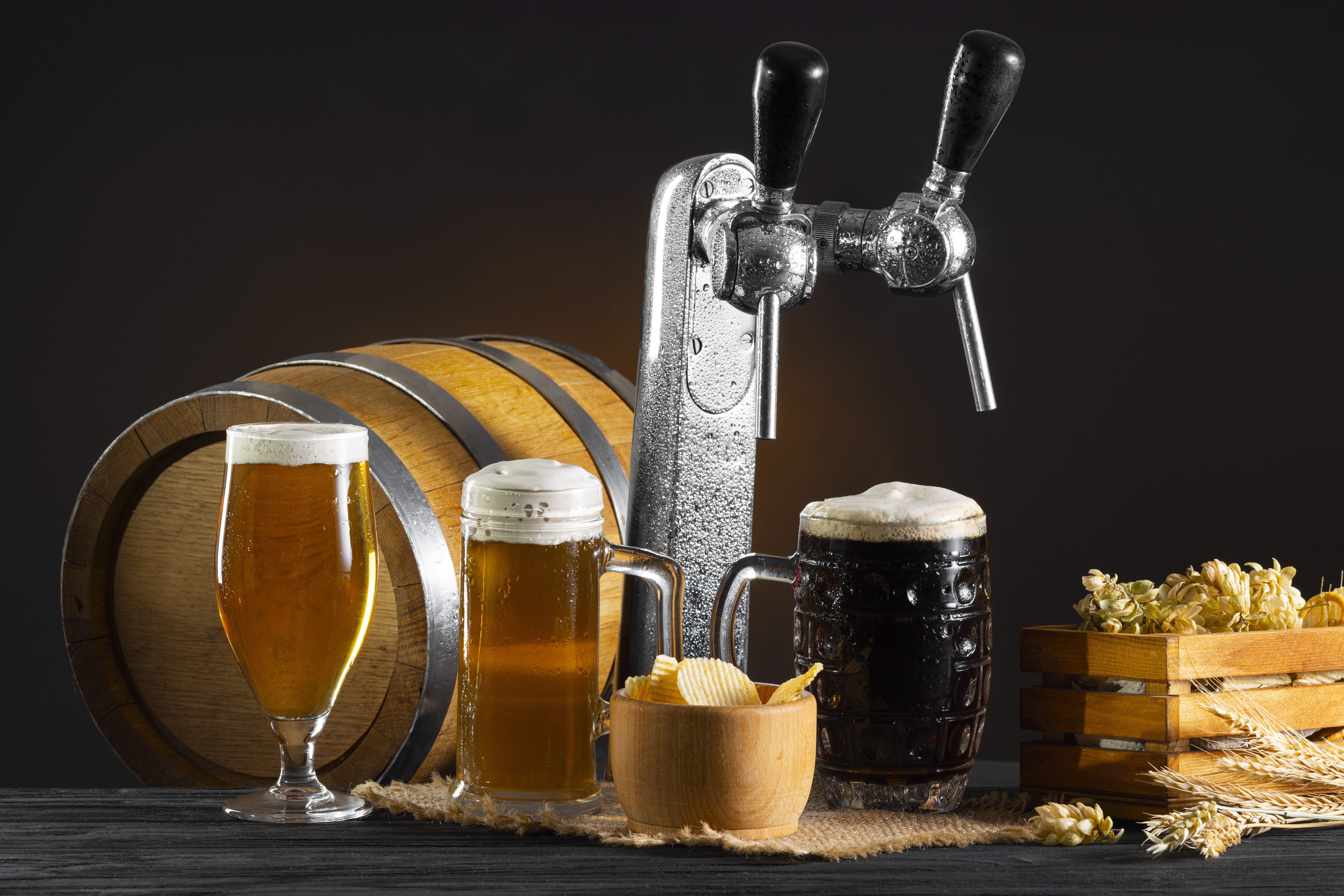 A table with beer glasses and barrels on it